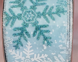 BLU WH SNWFL BLU SAT-2.5" WR This bow could be used for Christmas or a winter theme. Streamers will be solid ribbons in white and shades of blue. If available, a coordinating text streamer for the desired occasion could be added.