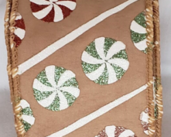 CNDY DISK TAN SAT-2.5" WR This bow is for a Christmas collection. Streamers will be solid ribbon in the colors of red, green, pink, white and tan. If available, a coordinating text streamer could be added.